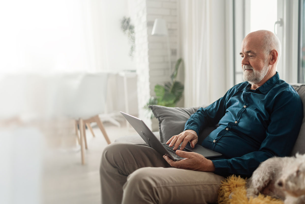 A man reading on a computer preparing for a doctor appointment